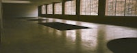 an empty room with a lot of windows