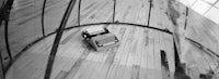 a black and white photo of a typewriter on a wooden floor