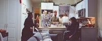 a group of people in a kitchen